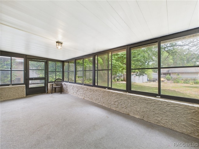 unfurnished sunroom featuring plenty of natural light