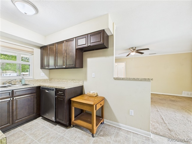 kitchen featuring stainless steel dishwasher, ceiling fan, dark brown cabinetry, a sink, and baseboards