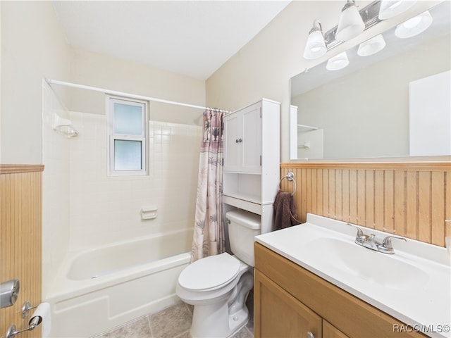 full bathroom with toilet, shower / tub combo, a wainscoted wall, vanity, and tile patterned floors
