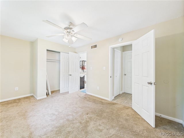 unfurnished bedroom with carpet flooring and baseboards