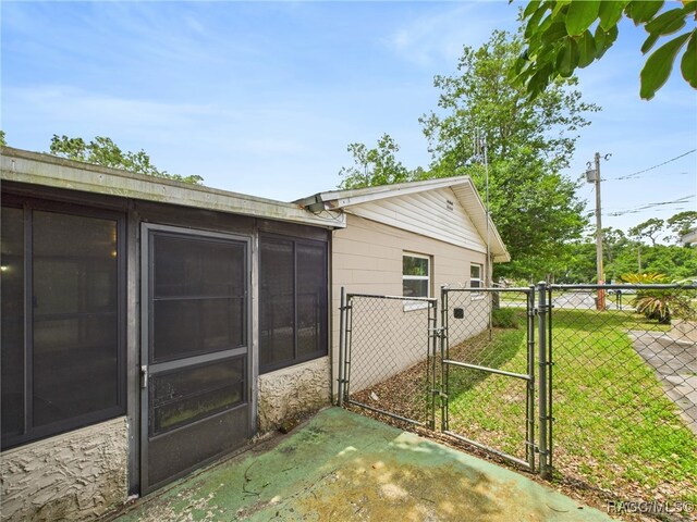 view of property exterior featuring a gate