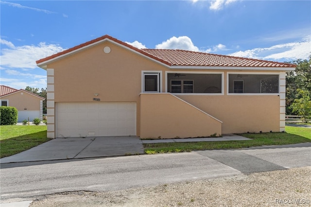 mediterranean / spanish-style home with a garage