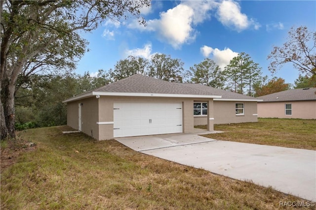 view of front of home featuring a garage and a front lawn