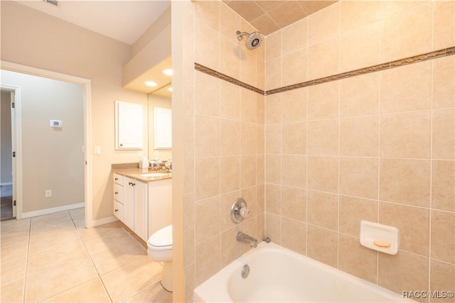 full bathroom with vanity, tiled shower / bath combo, tile patterned floors, and toilet