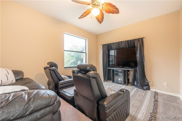 carpeted living room featuring ceiling fan