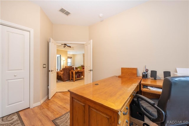 office with light hardwood / wood-style flooring