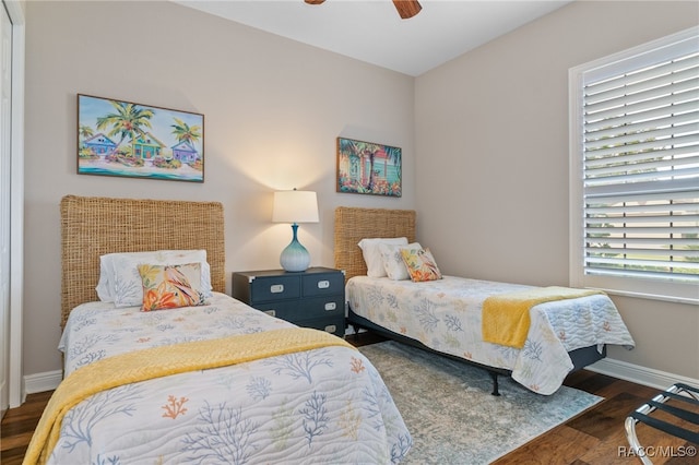 bedroom featuring ceiling fan and dark wood-type flooring