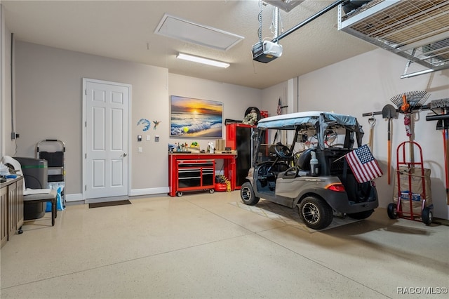 garage featuring a workshop area and a garage door opener