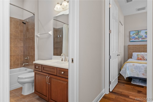 full bathroom featuring toilet, vanity, shower / tub combo, and hardwood / wood-style flooring