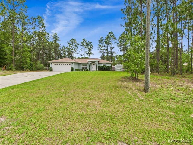 1899 W Oliver Dr, Citrus Springs, FL 34434 - single story home featuring concrete driveway, a garage, and a front yard