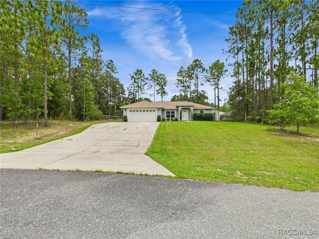 1899 W Oliver Dr, Citrus Springs, FL 34434 - view of front of property with a garage and concrete driveway