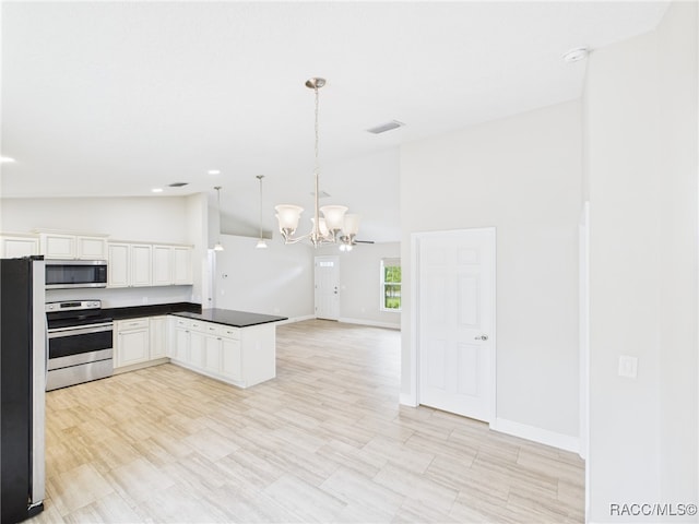 1899 W Oliver Dr, Citrus Springs, FL 34434 - kitchen with stainless steel appliances, a chandelier, dark countertops, open floor plan, and pendant lighting