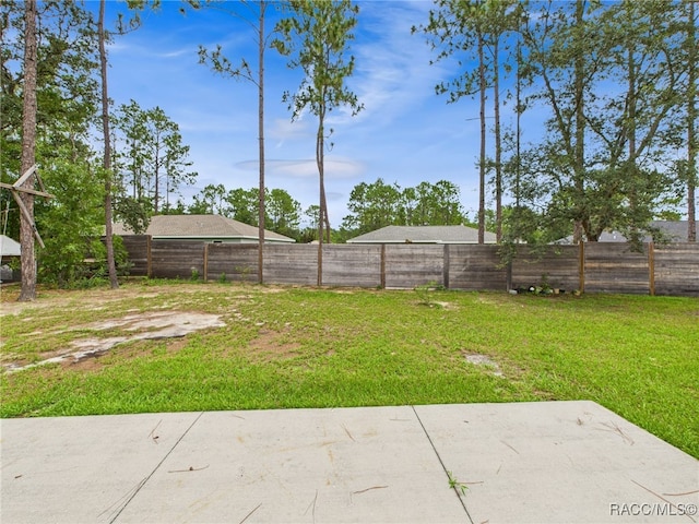 1899 W Oliver Dr, Citrus Springs, FL 34434 - fenced backyard with a patio