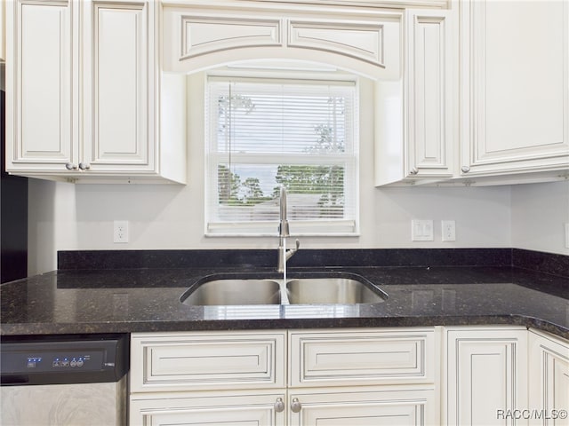 1899 W Oliver Dr, Citrus Springs, FL 34434 - kitchen with stainless steel dishwasher, white cabinets, and dark stone countertops