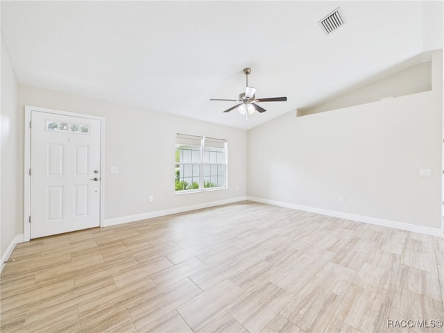 1899 W Oliver Dr, Citrus Springs, FL 34434 - spare room with ceiling fan, vaulted ceiling, and light wood-type flooring