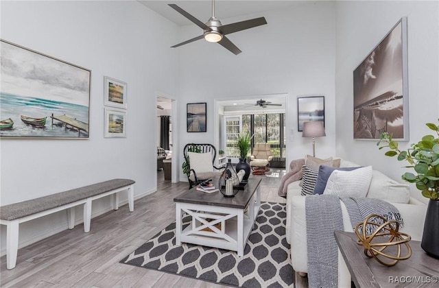 340 E Glassboro Ct Unit 19-5A, Hernando, FL 34442 - living area with a ceiling fan, wood finished floors, and high vaulted ceiling