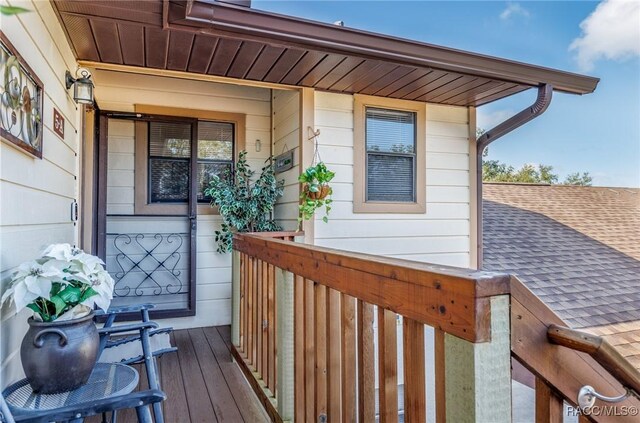 340 E Glassboro Ct Unit 19-5A, Hernando, FL 34442 - entrance to property featuring a porch and roof with shingles