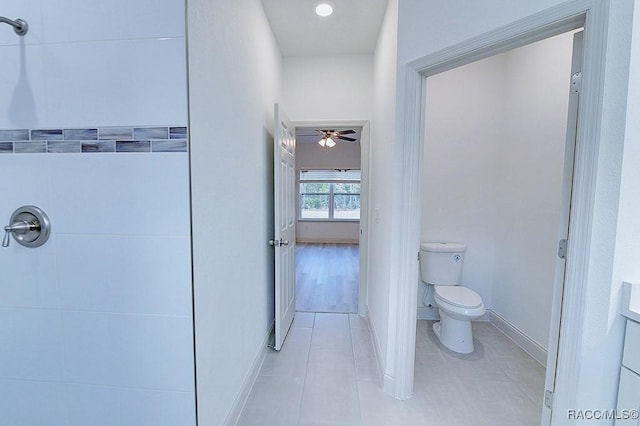 bathroom with tile patterned floors, ceiling fan, and toilet