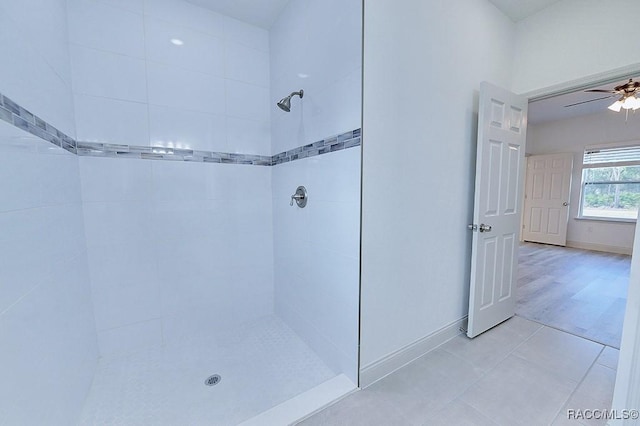 bathroom featuring a tile shower, ceiling fan, and tile patterned floors