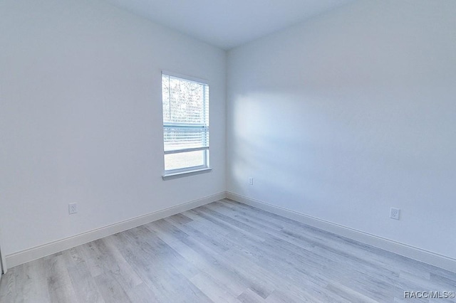 empty room with light hardwood / wood-style floors