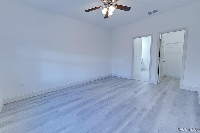 unfurnished room with ceiling fan and light hardwood / wood-style floors