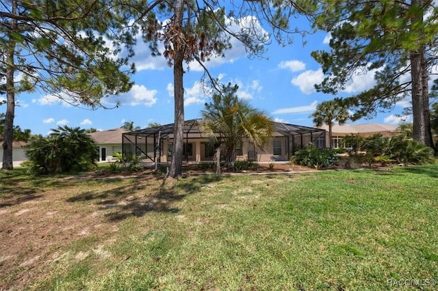 15776 SW 11th Terrace Rd, Ocala, FL 34473 - rear view of property with a yard, a lanai, and stucco siding