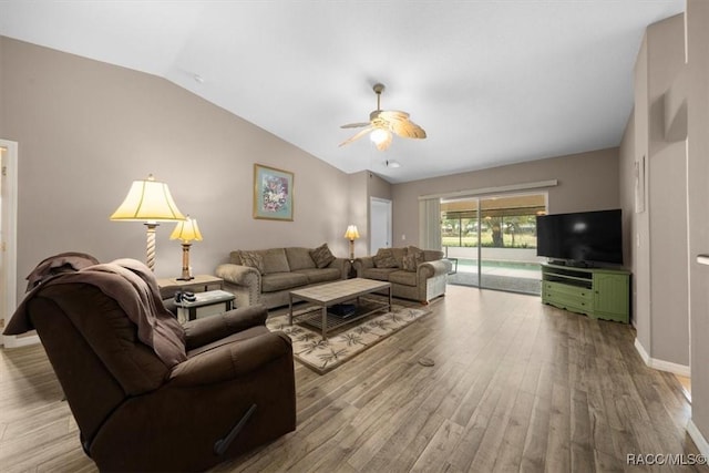 15776 SW 11th Terrace Rd, Ocala, FL 34473 - living room featuring wood finished floors, ceiling fan, and vaulted ceiling
