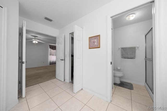15776 SW 11th Terrace Rd, Ocala, FL 34473 - full bath featuring tile patterned floors, a stall shower, and a ceiling fan