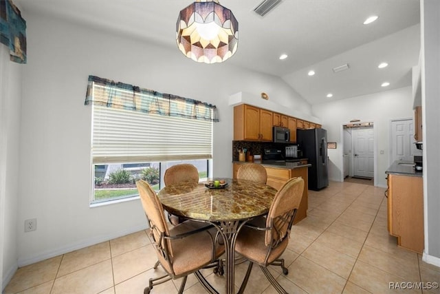 15776 SW 11th Terrace Rd, Ocala, FL 34473 - dining room featuring light tile patterned floors, recessed lighting, and vaulted ceiling