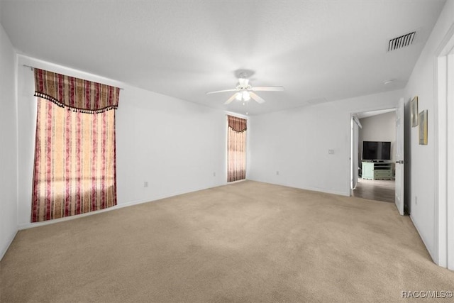 15776 SW 11th Terrace Rd, Ocala, FL 34473 - unfurnished room with light colored carpet and ceiling fan