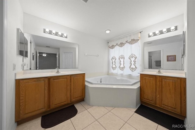 15776 SW 11th Terrace Rd, Ocala, FL 34473 - full bathroom featuring two vanities, a bath, ceiling fan, and tile patterned floors