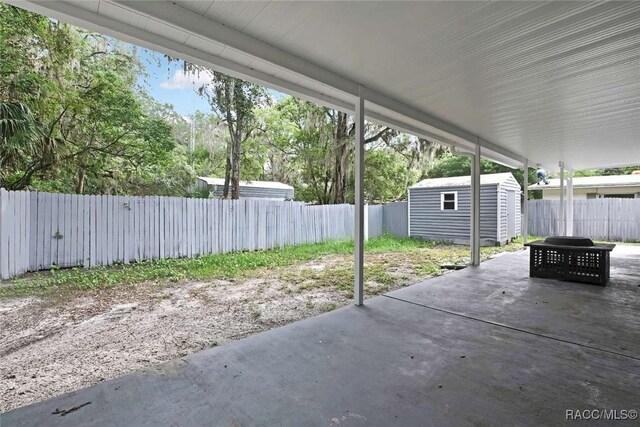 657 NE 11th St, Crystal River, FL 34428 - fenced backyard featuring a patio area