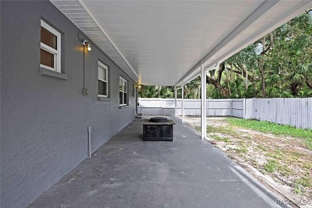 657 NE 11th St, Crystal River, FL 34428 - fenced backyard featuring a patio area