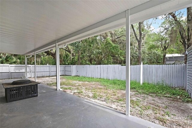 657 NE 11th St, Crystal River, FL 34428 - fenced backyard featuring a patio area