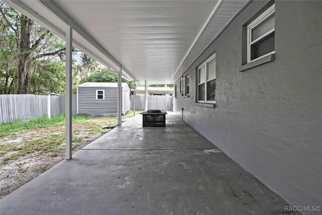 657 NE 11th St, Crystal River, FL 34428 - fenced backyard featuring a patio area