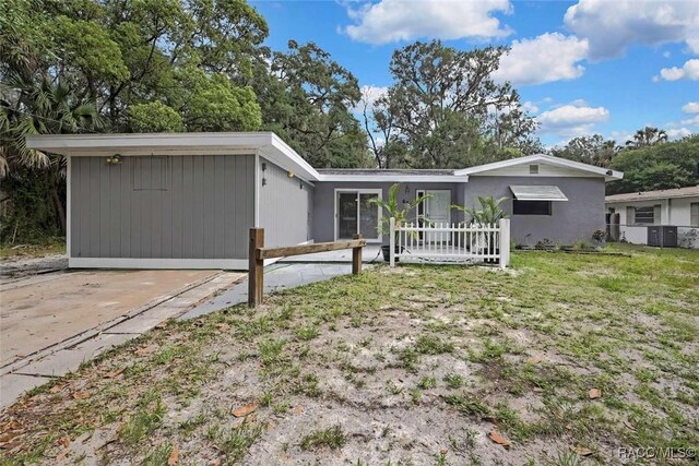 657 NE 11th St, Crystal River, FL 34428 - view of front facade with central AC unit