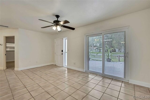 657 NE 11th St, Crystal River, FL 34428 - unfurnished room featuring baseboards, ceiling fan, and light tile patterned floors
