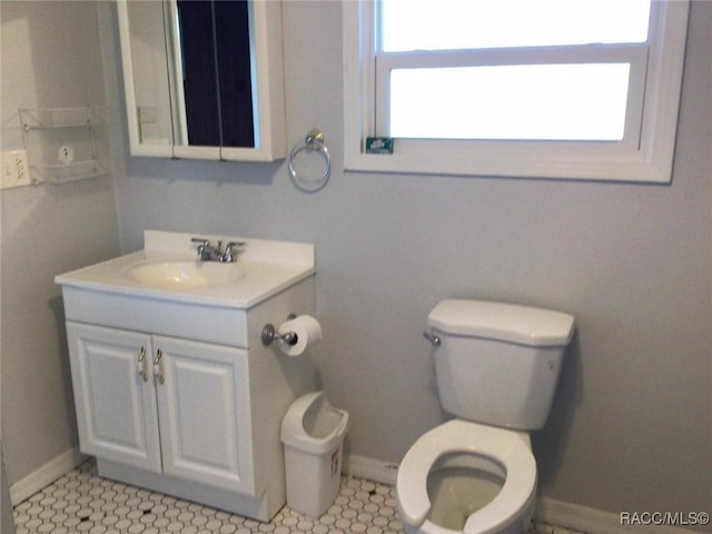 bathroom featuring vanity and toilet