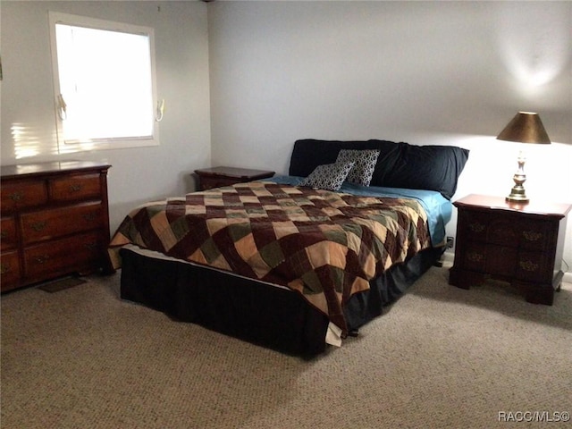 bedroom with light carpet