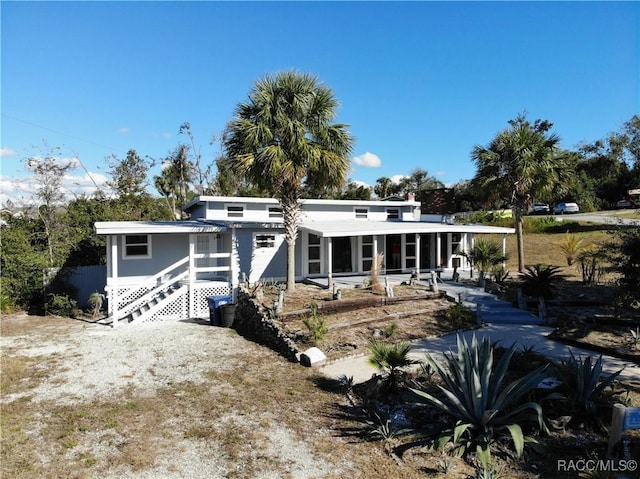 view of front of home with a sunroom