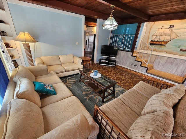 living room with beam ceiling and wooden ceiling