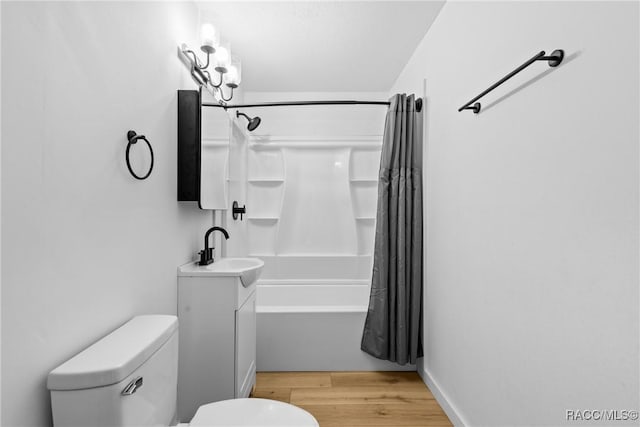 full bathroom featuring shower / bath combo, wood-type flooring, vanity, and toilet