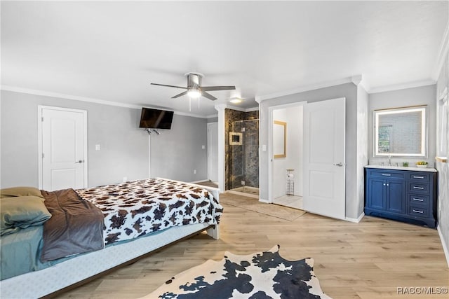 bedroom with ensuite bath, light hardwood / wood-style flooring, ornamental molding, and ceiling fan