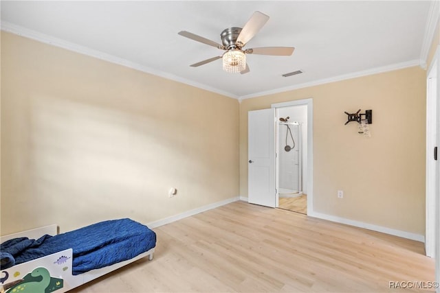 bedroom with crown molding, ceiling fan, wood-type flooring, and connected bathroom