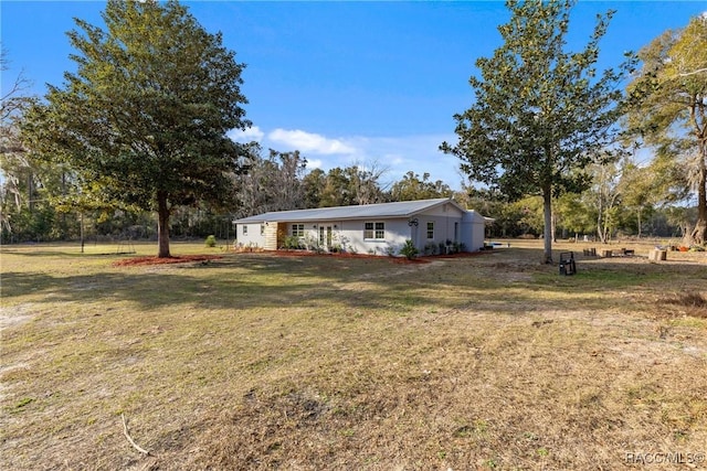 ranch-style house with a front lawn