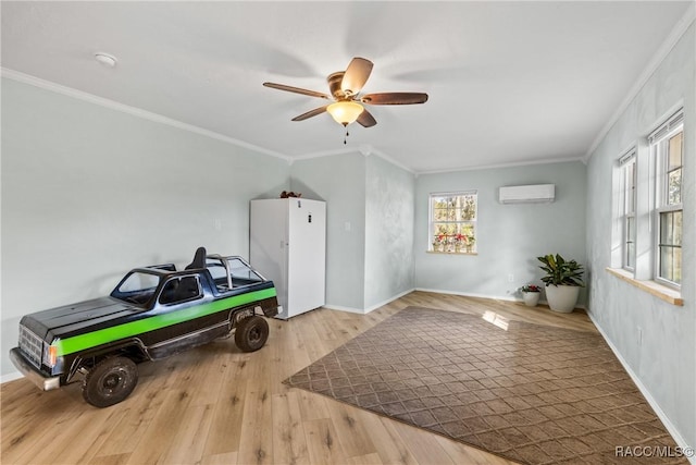 rec room with crown molding, hardwood / wood-style flooring, a wall unit AC, and ceiling fan