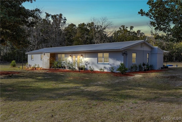 view of front of home with a lawn