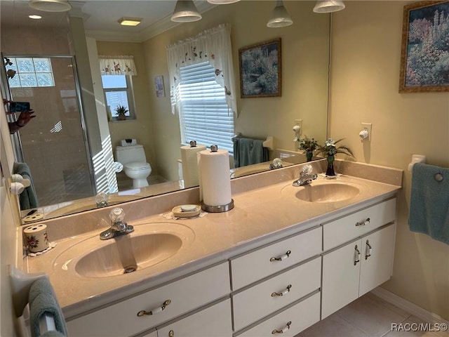 bathroom featuring an enclosed shower, tile patterned flooring, toilet, vanity, and crown molding