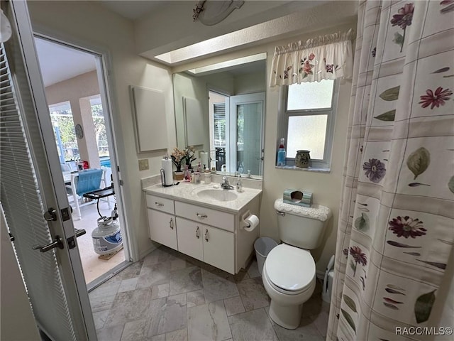 bathroom with toilet and vanity