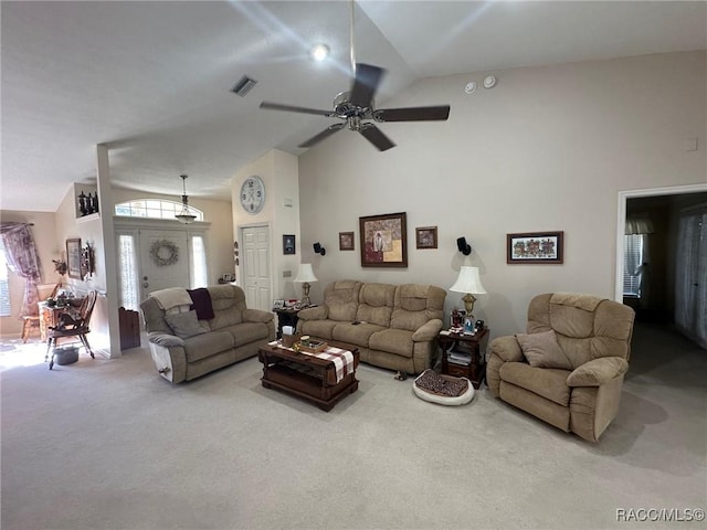 living area featuring carpet floors, high vaulted ceiling, visible vents, and a ceiling fan